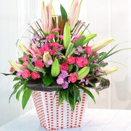 Pink & Purple bouquet in container, Pink & Purple bouquet in container